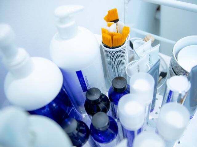 Skincare and treatment products on a clinic trolley