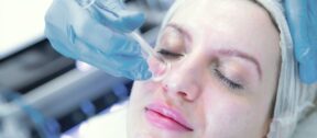 HydraFacial handpiece used on the face during treatment