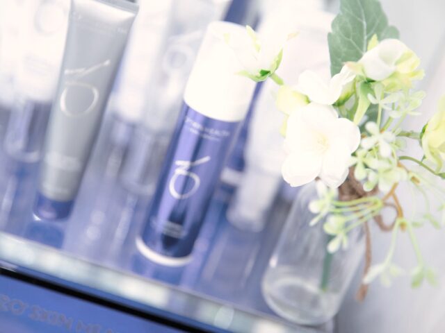 ZO Skin Health bottles and jars displayed on a shelf in the clinic